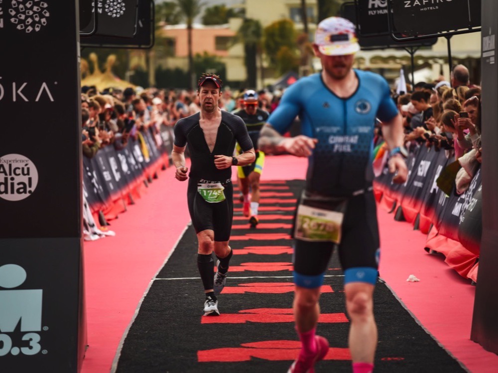 Athletes on an IRONMAN 70.3 finish chute